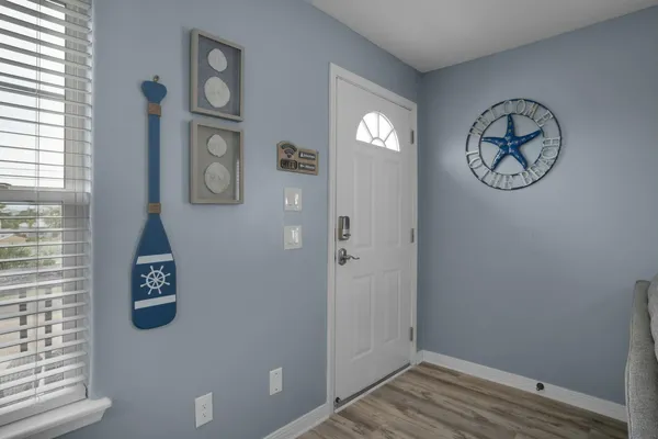 a view of a balcony with a yard