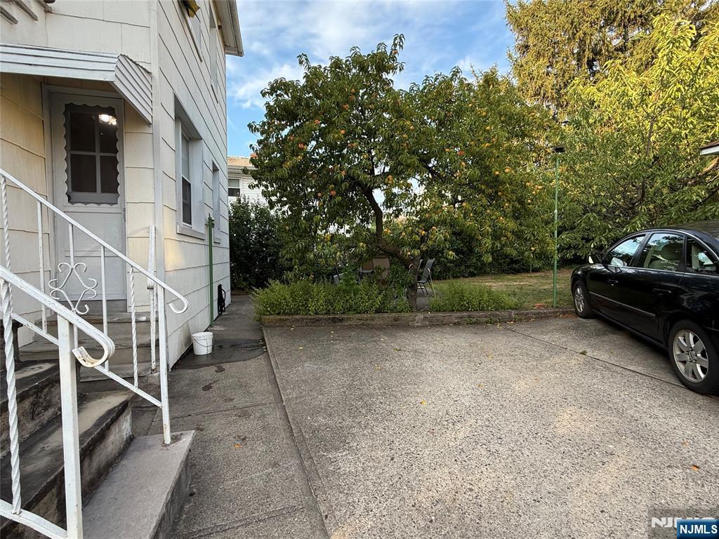 84 9th Street, Unit 1 Wood-Ridge, NJ 07075 - Photo 22 of 22 a view of a car park in front of a building