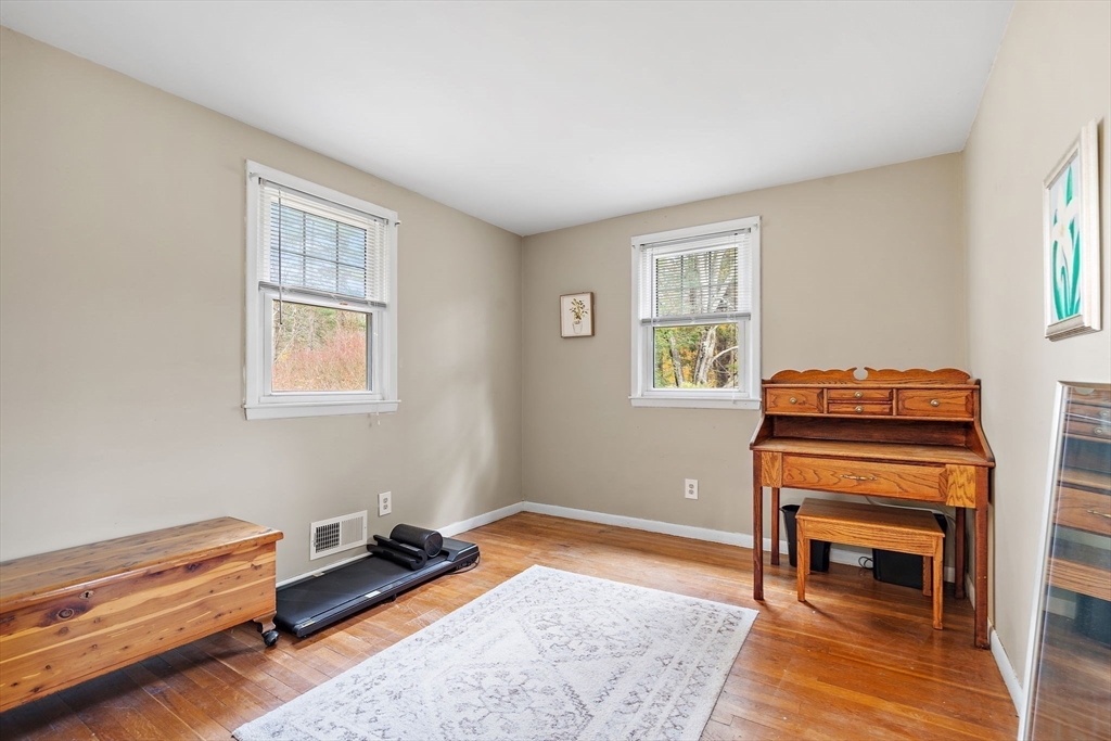 30 Rolling Lane Sudbury, MA 01776 - Photo 11 of 25 a bedroom with a bed and a window