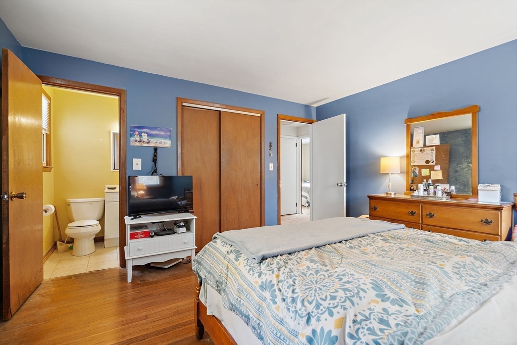 30 Rolling Lane Sudbury, MA 01776 - Photo 14 of 25 a bedroom with a bed and a dresser in it