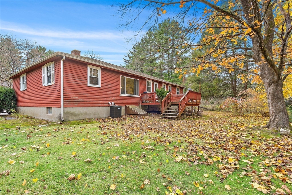 30 Rolling Lane Sudbury, MA 01776 - Photo 23 of 25 a backyard of a house with table and chairs