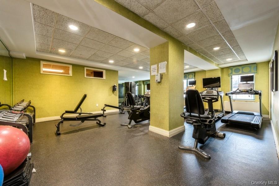 116-12 Ocean Promenade, Unit 210 Queens, NY 11694 - Photo 23 of 28 Gym featuring a paneled ceiling and recessed lighting