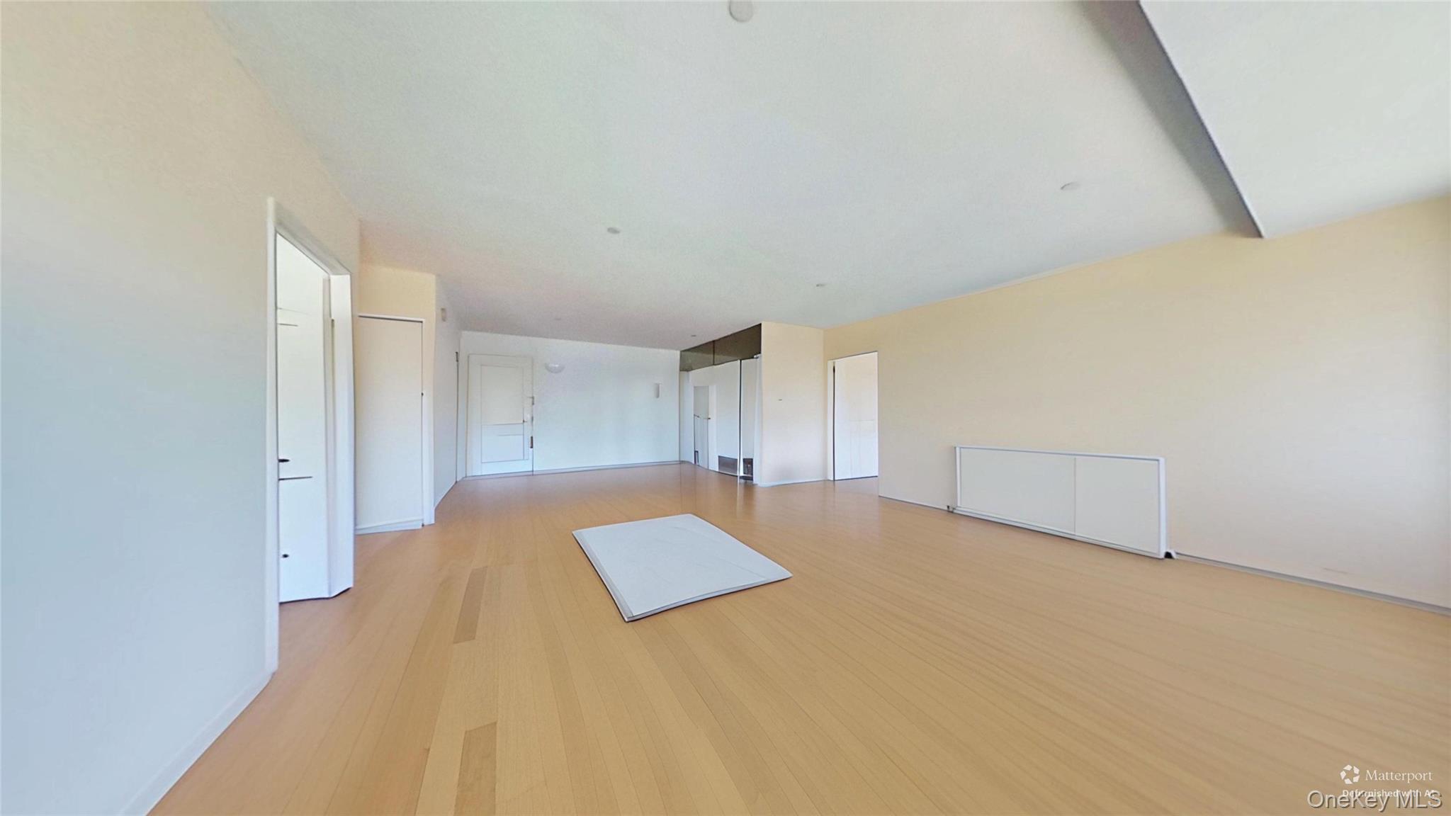 116-12 Ocean Promenade, Unit 210 Queens, NY 11694 - Photo 9 of 28 Additional living space featuring light wood-type flooring