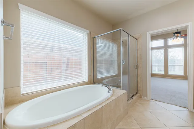 a white bath tub sitting next to a window