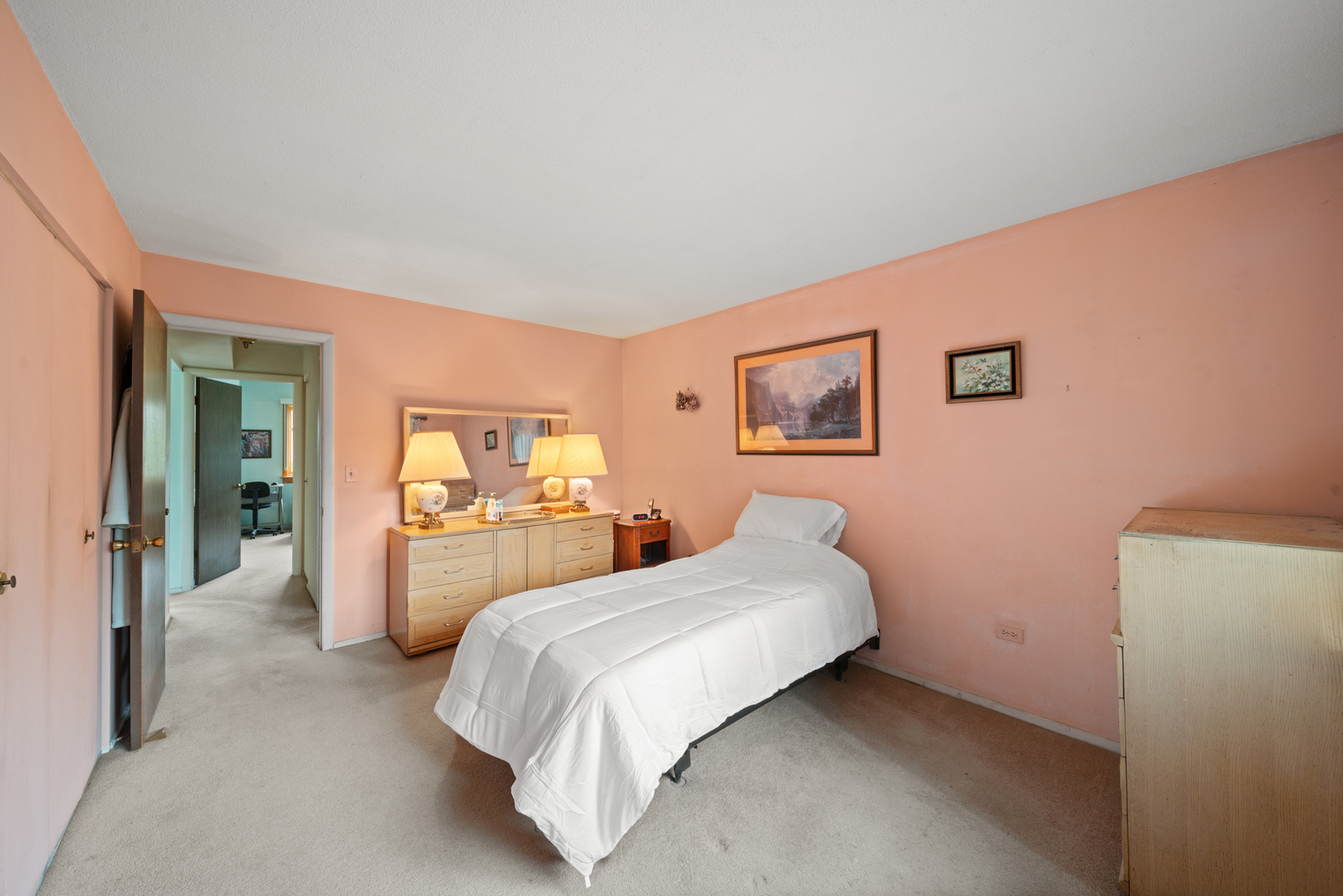 622 Cobblestone Circle, Unit C Glenview, IL 60025 - Photo 13 of 20 a bedroom with a bed and dresser with mirror