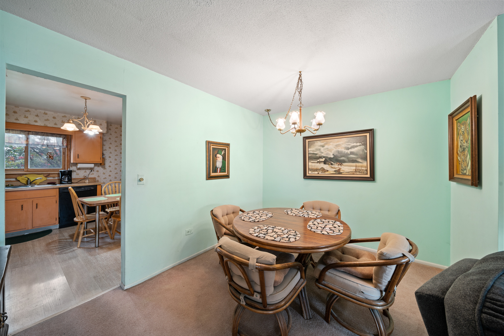 622 Cobblestone Circle, Unit C Glenview, IL 60025 - Photo 8 of 20 a view of a dining room with furniture and chandelier