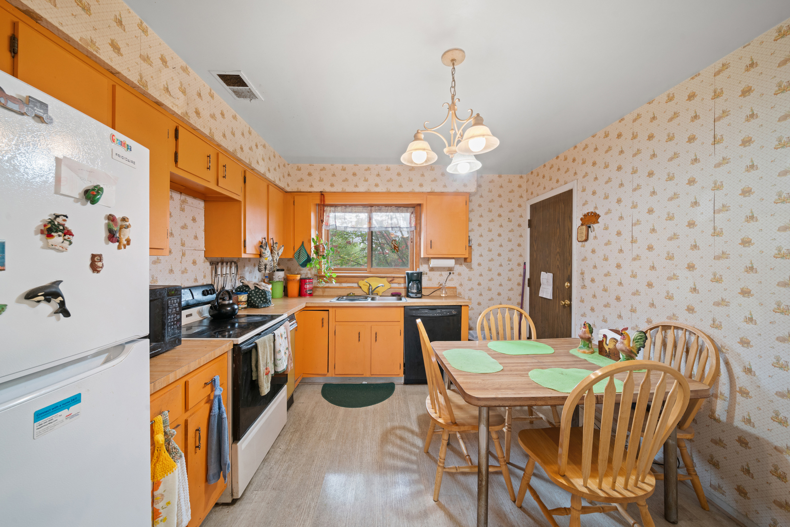 622 Cobblestone Circle, Unit C Glenview, IL 60025 - Photo 10 of 20 a view of a dining room with furniture a chandelier and large window
