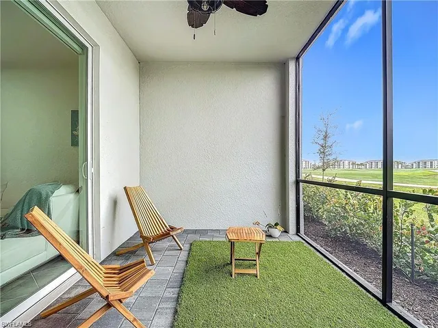 a view of a room with a table and chairs