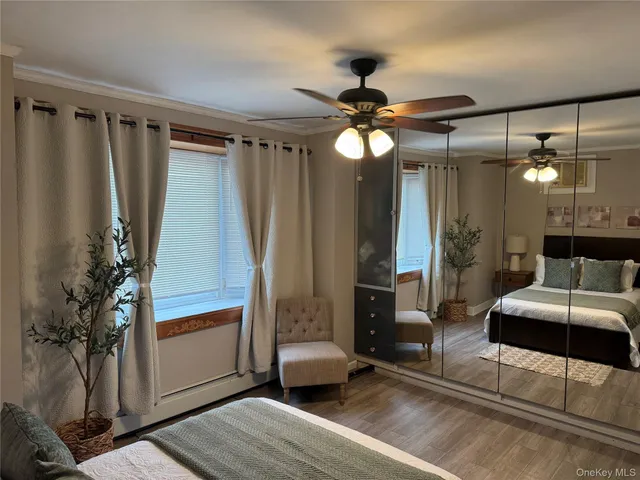a view of a livingroom with furniture and a ceiling fan