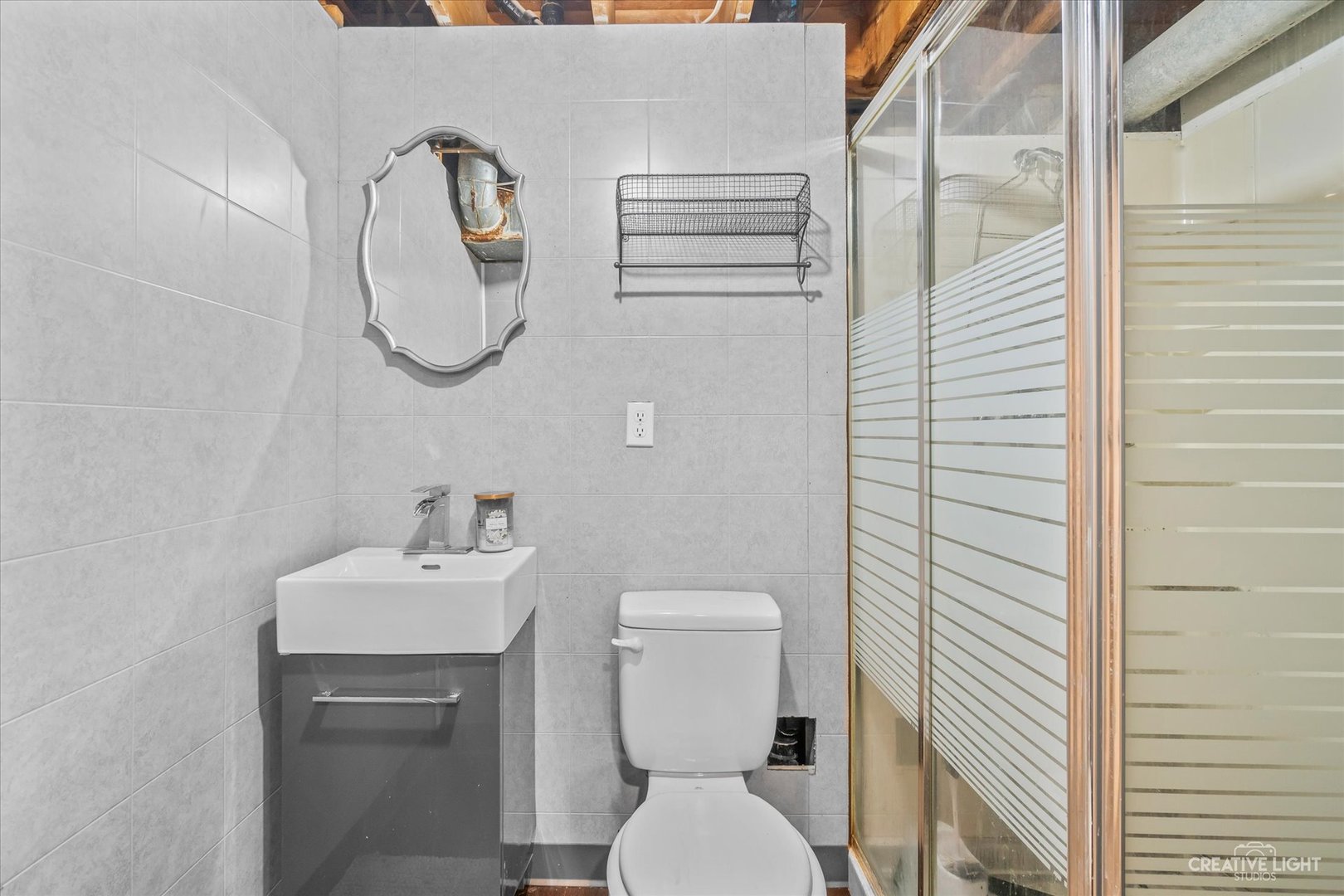 8 Shermead Road Montgomery, IL 60538 - Photo 14 of 17 a bathroom with a toilet sink and mirror