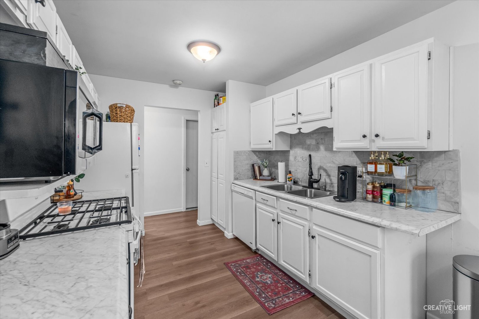 8 Shermead Road Montgomery, IL 60538 - Photo 6 of 17 a kitchen with refrigerator and cabinets