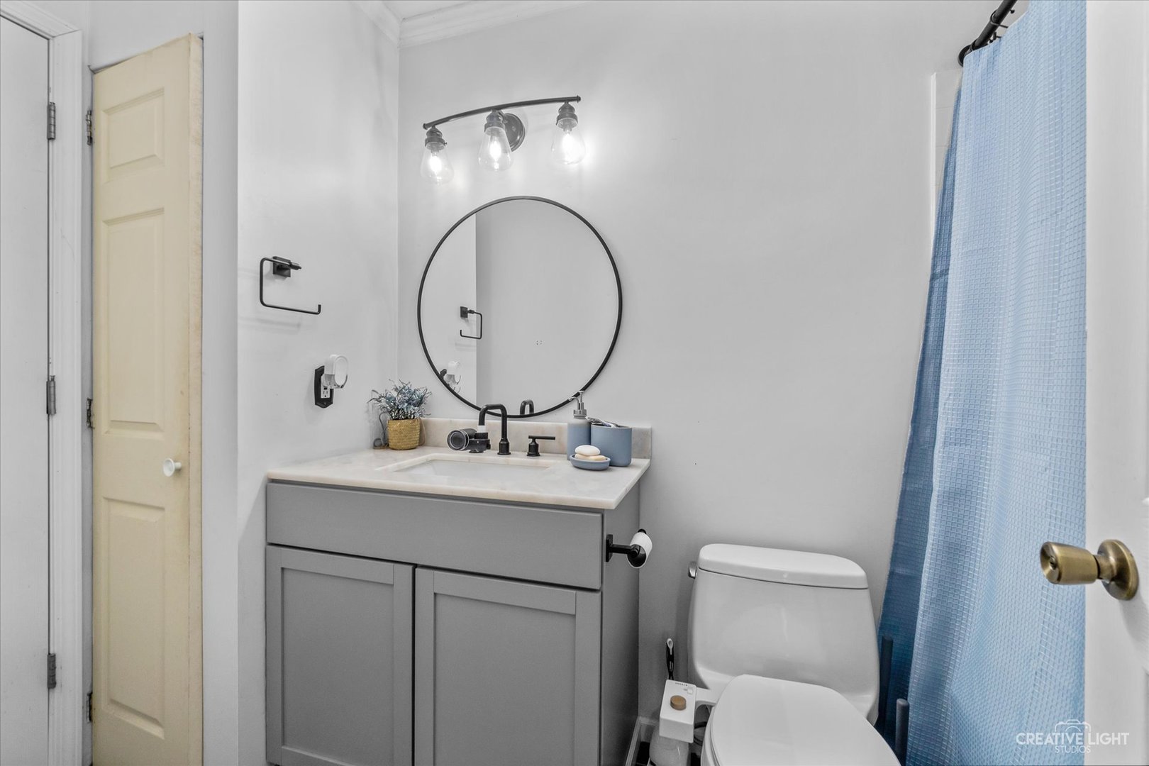 8 Shermead Road Montgomery, IL 60538 - Photo 10 of 17 a bathroom with a toilet a sink and mirror