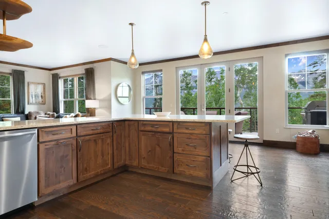 a bathroom with double vanity sinks and a mirror