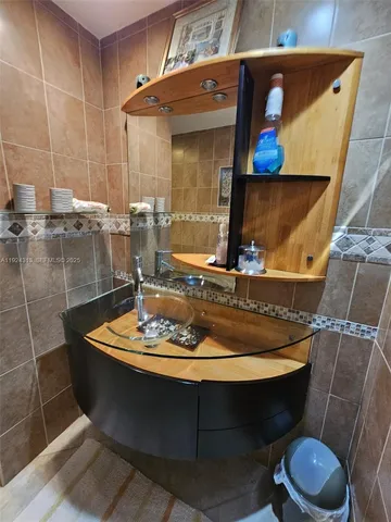 a dining room with a table and chairs