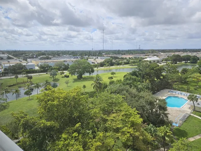 a view of a lake with green field