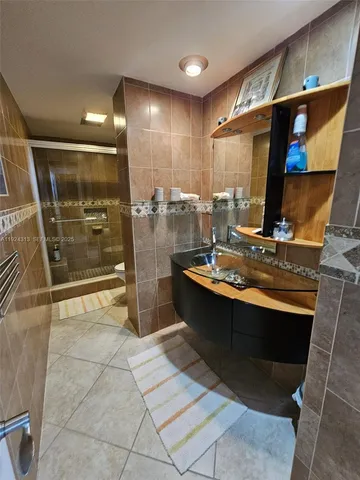 a kitchen with stainless steel appliances granite countertop a sink and a stove