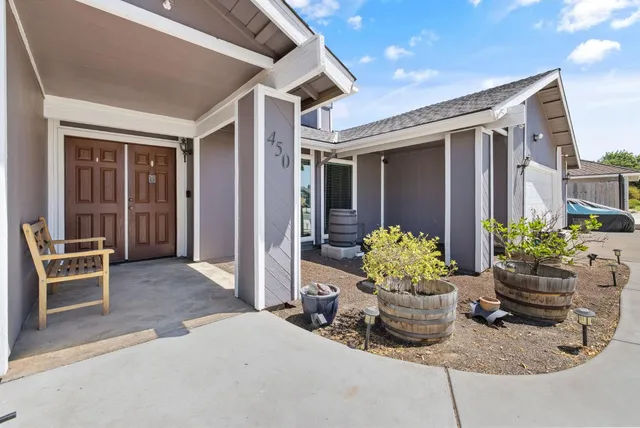 a dining room with furniture and flowers