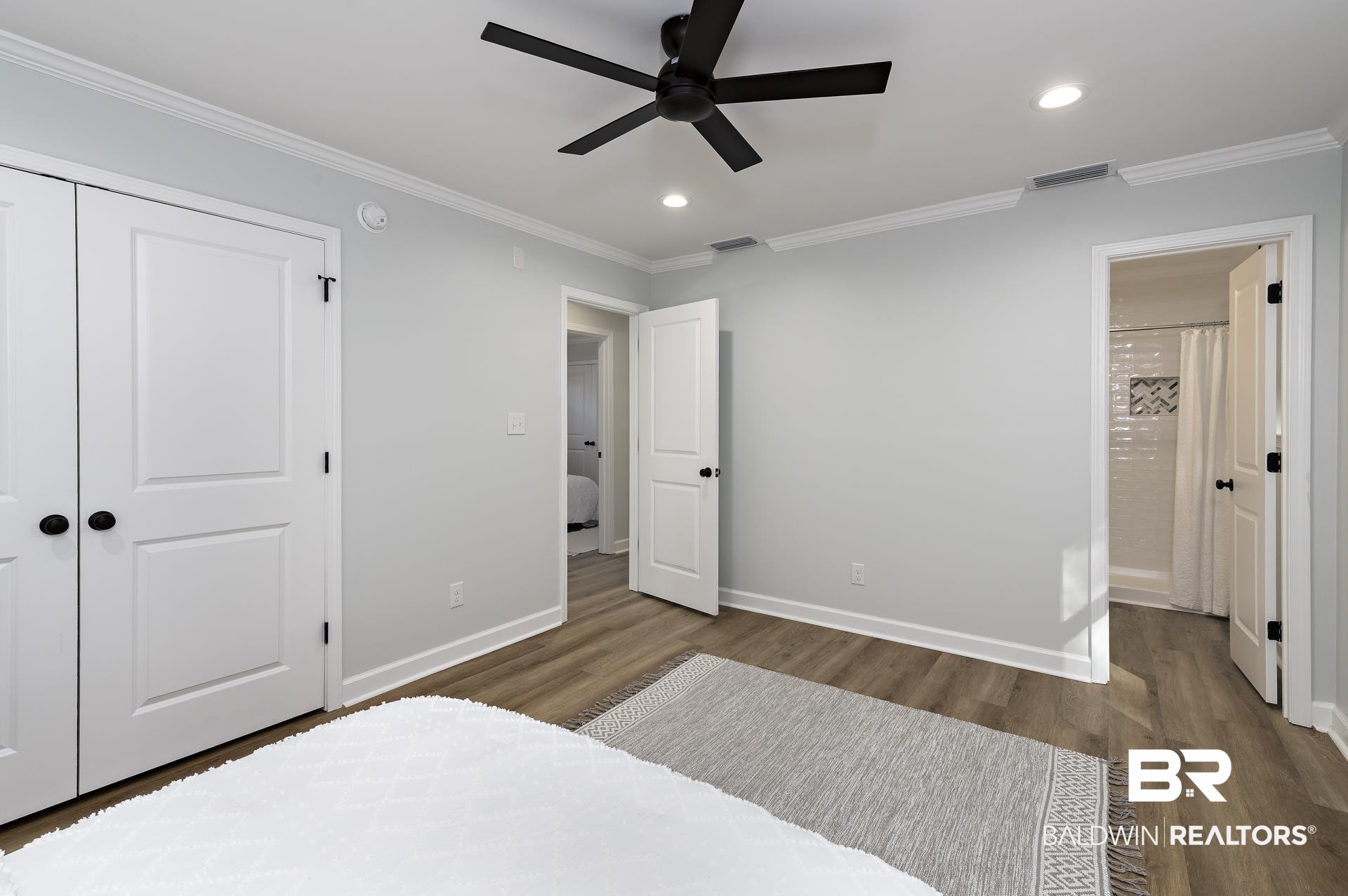 6001 Camp Halls Mill Road Mobile, AL 36619 - Photo 33 of 52 Bedroom with dark wood-type flooring, recessed lighting, crown molding, ceiling fan, and connected bathroom