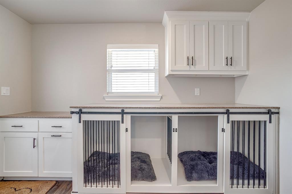 733 Fm 2652 Graham, TX 76450 - Photo 23 of 40 a kitchen with white cabinets and a window