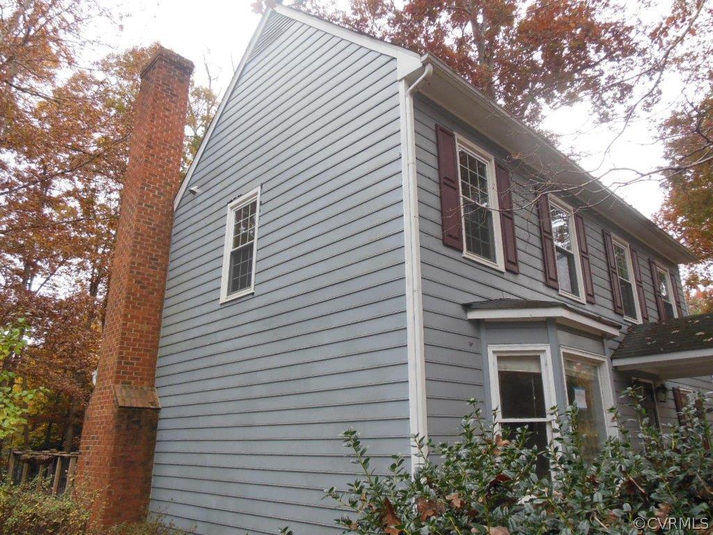 5513 Chatmoss Road Midlothian, VA 23112 - Photo 14 of 18 a front view of a house with a tree