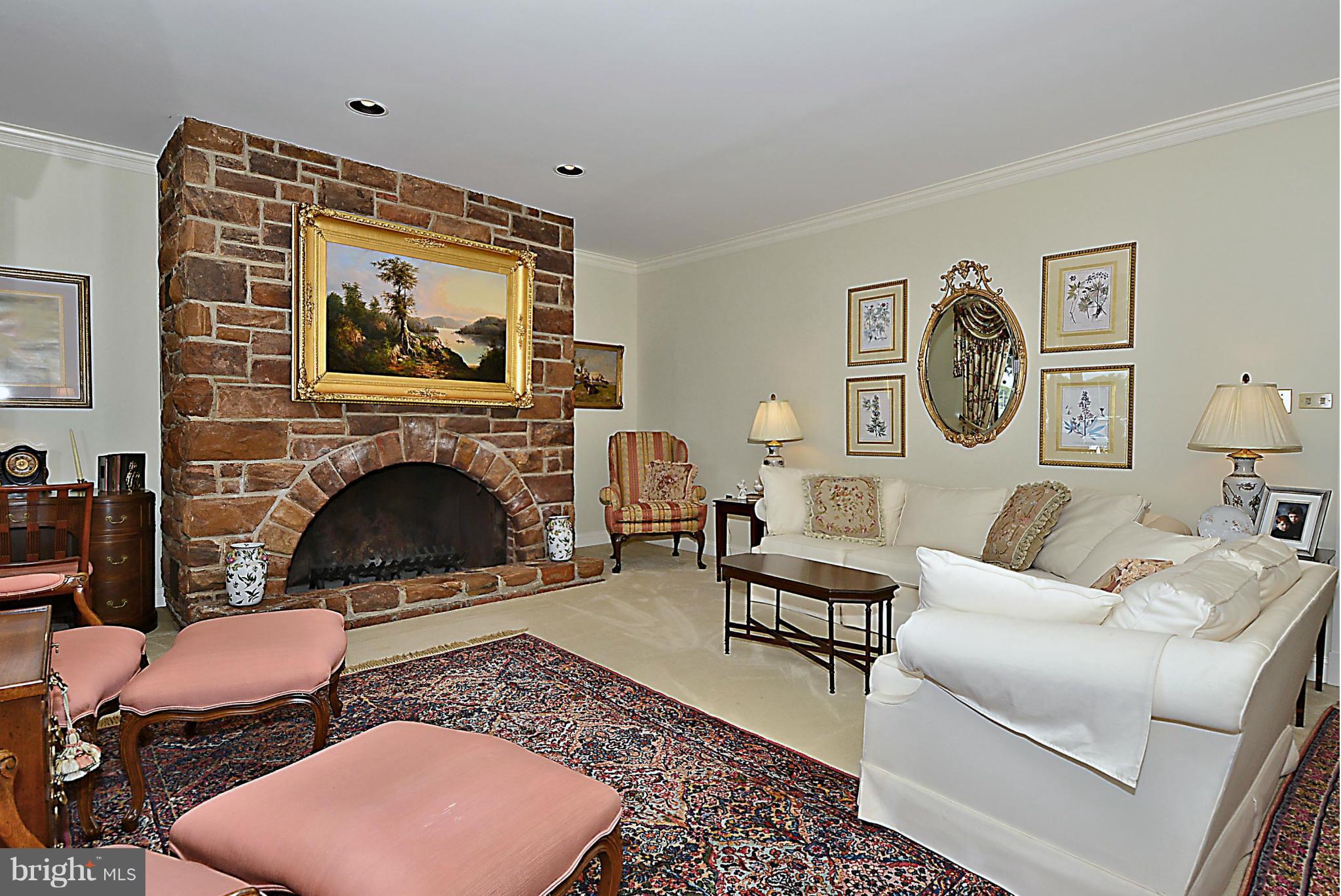 525 Broadwater Road Arnold, MD 21012 - Photo 14 of 30 Living Room is flanked by a stone fireplace.