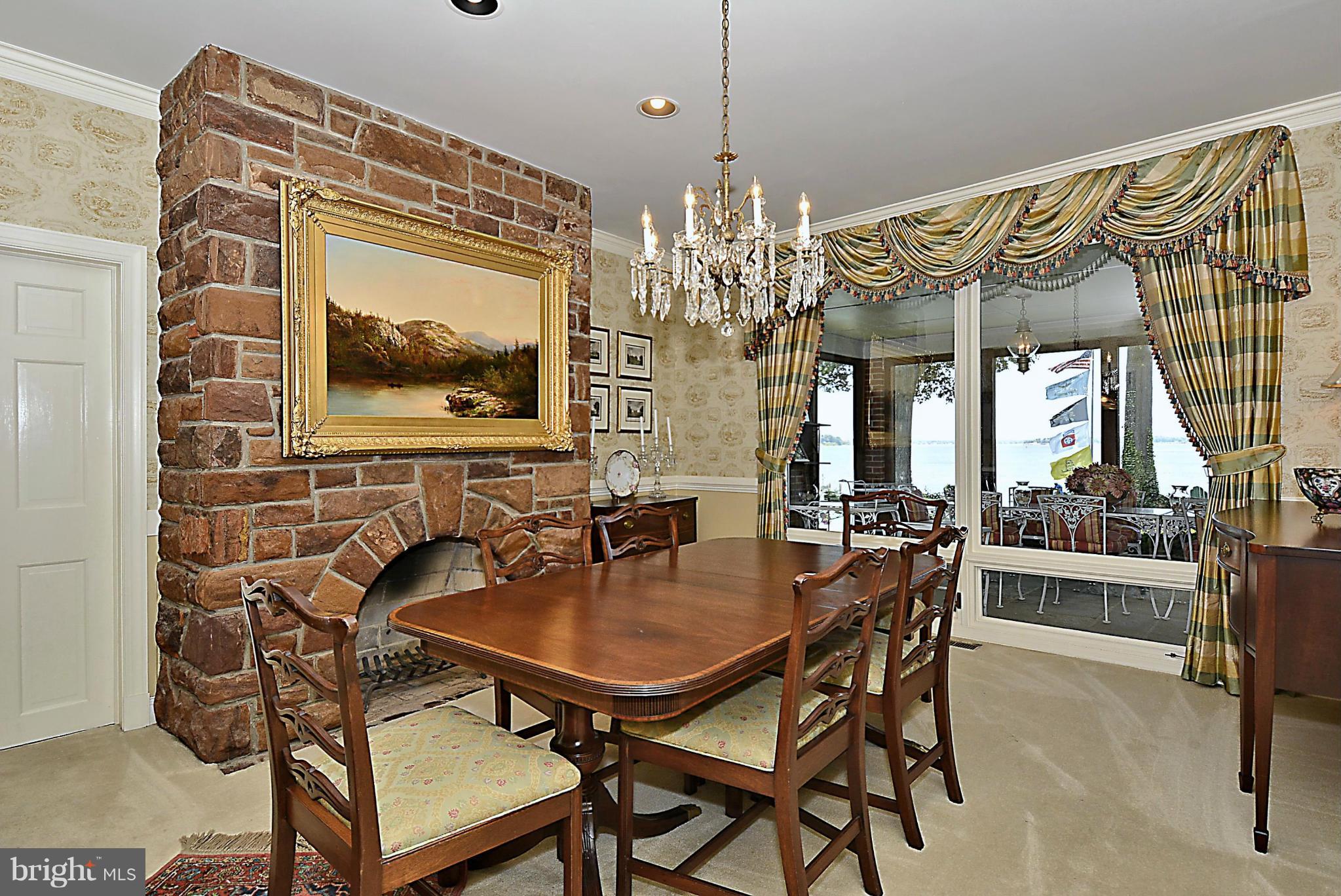 525 Broadwater Road Arnold, MD 21012 - Photo 16 of 30 Spacious DR is flanked by a stone fireplace too.