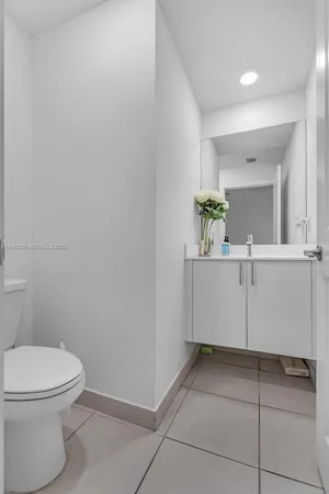 a bathroom with a sink and toilet