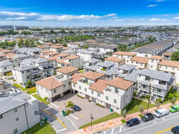 an aerial view of a city with lots of residential buildings