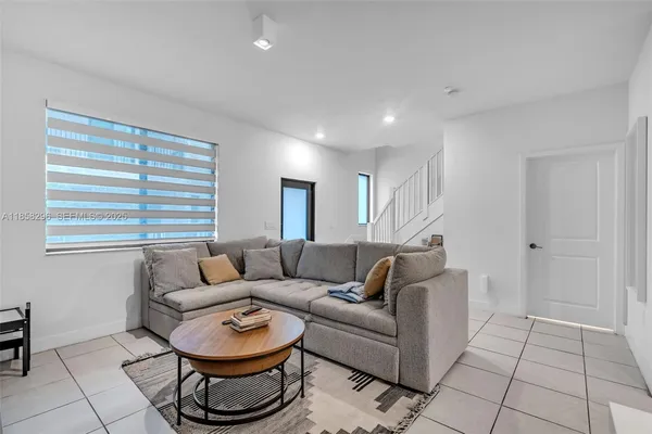 a living room with furniture and a window