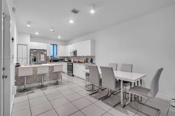 a view of kitchen with cabinets and outdoor seating
