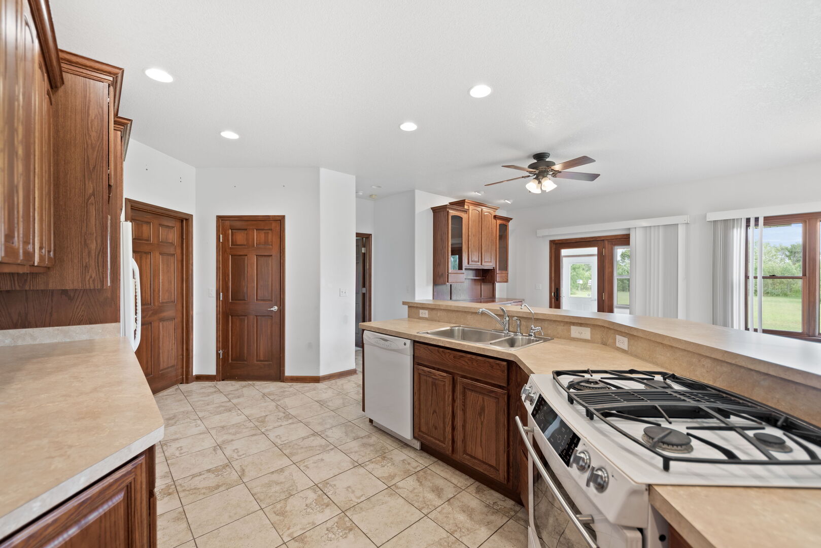 2745 South Hieland Road St. Anne, IL 60964 - Photo 12 of 31 a kitchen with a stove and a sink