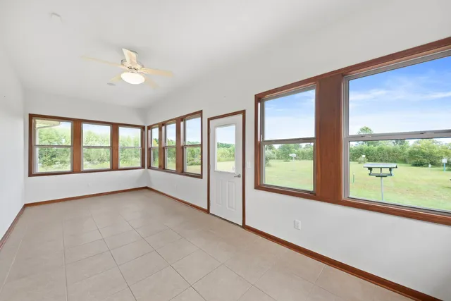 a view of an empty room with a large window
