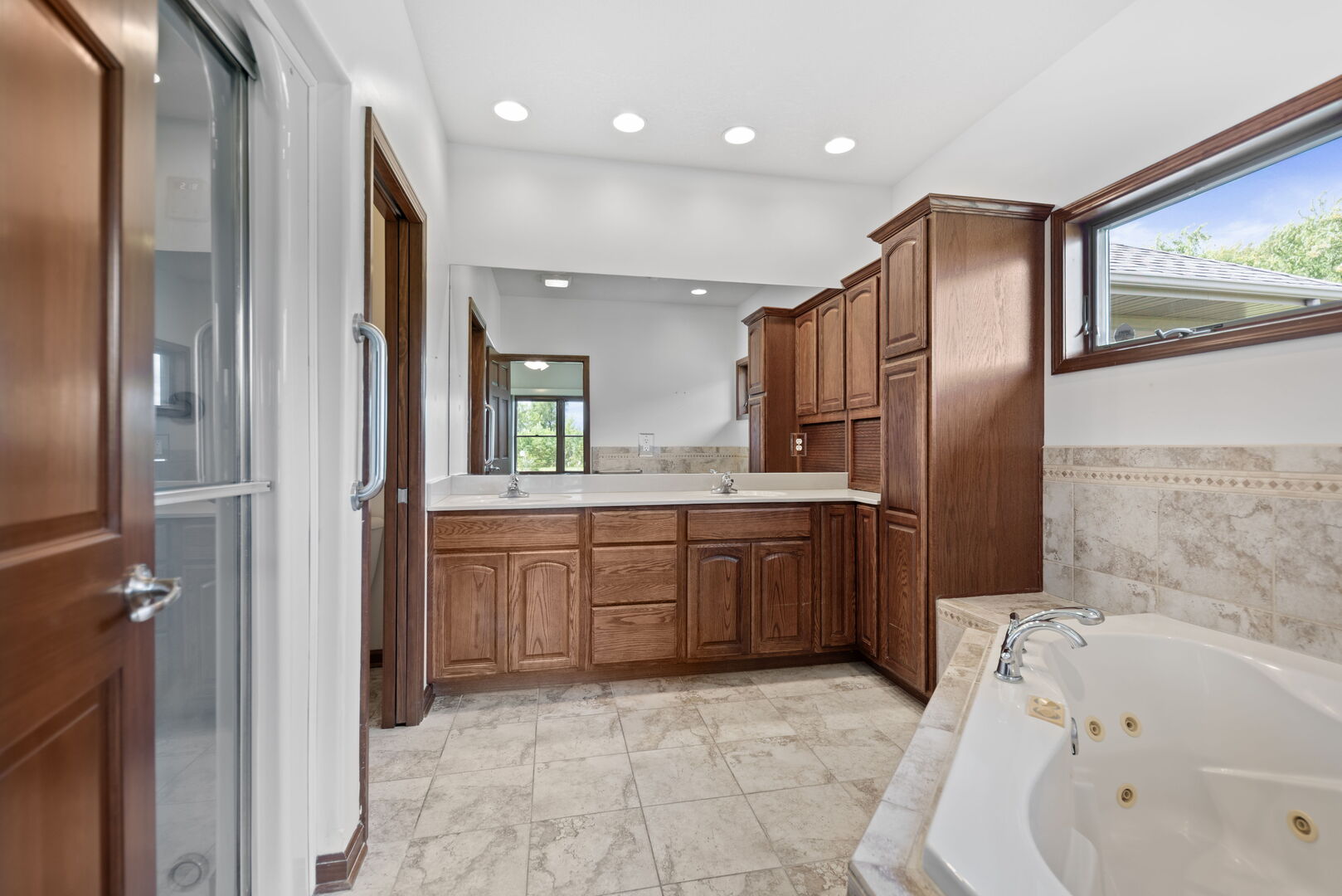 2745 South Hieland Road St. Anne, IL 60964 - Photo 15 of 31 a bathroom with a bathtub sink and mirror