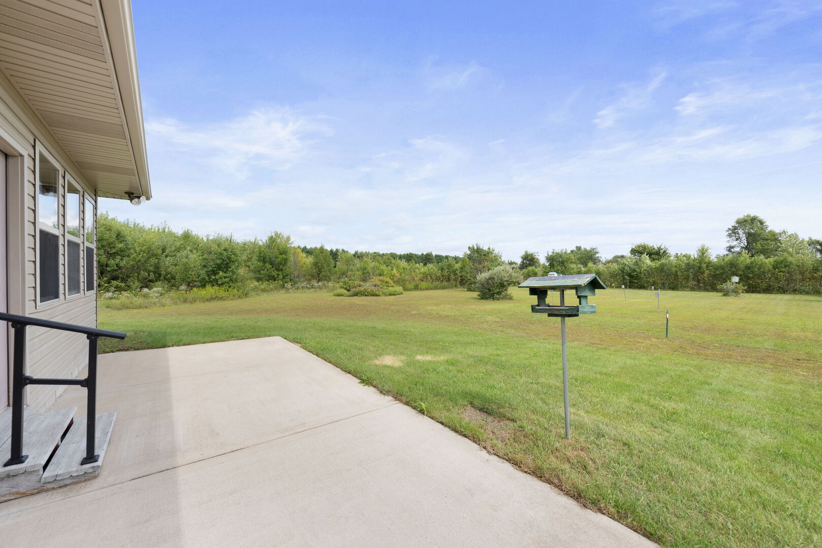 2745 South Hieland Road St. Anne, IL 60964 - Photo 24 of 31 a view of a garden with a lake