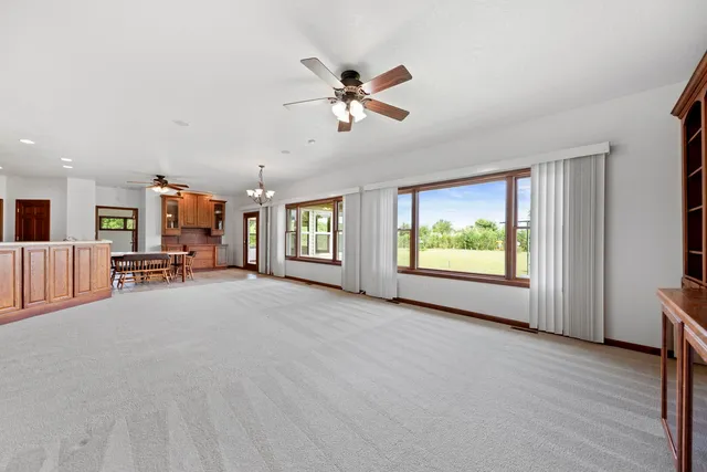 a view of a livingroom with furniture and a window