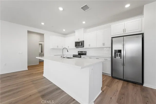 a bathroom with a shower and a sink