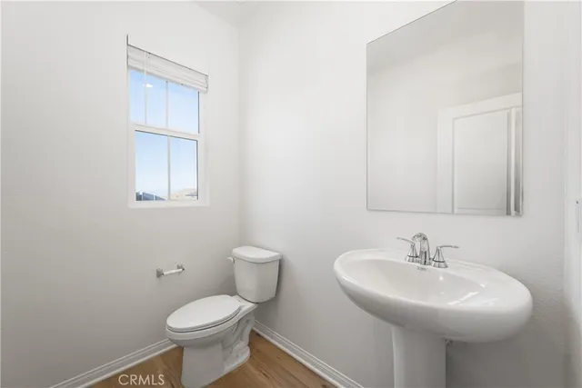 a view of an empty room with a kitchen