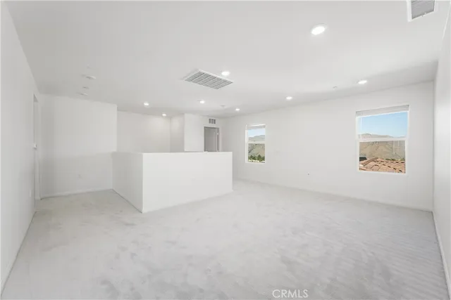 a spacious bathroom with a granite countertop sink a mirror and a