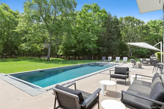 a view of a chairs and table in the yard