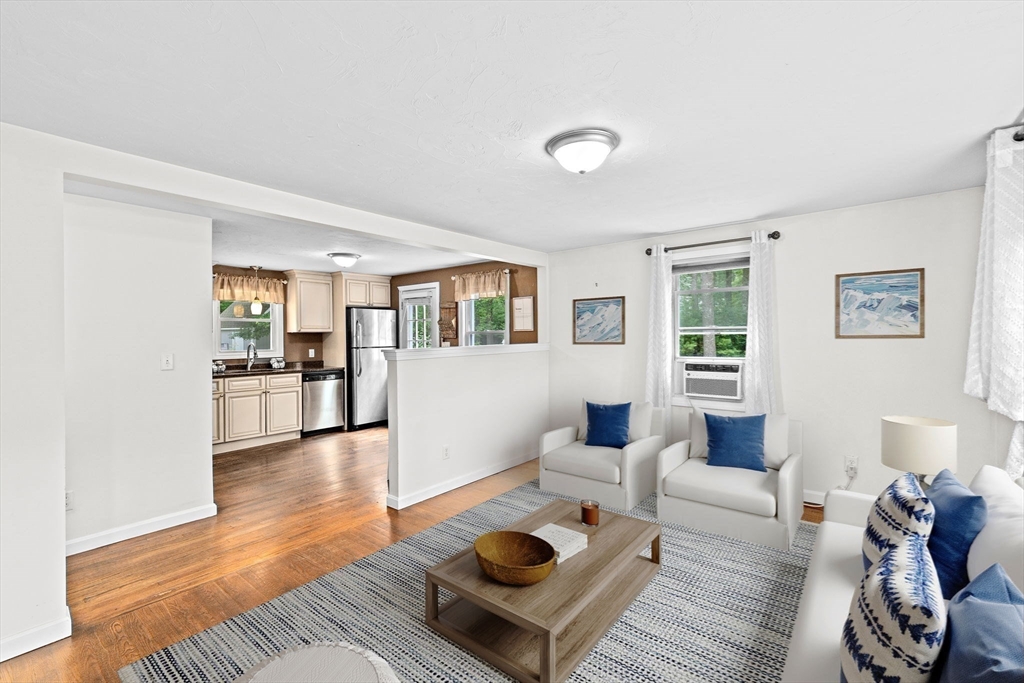 74 Rochester Road Carver, MA 02330 - Photo 11 of 31 a living room with furniture and wooden floor