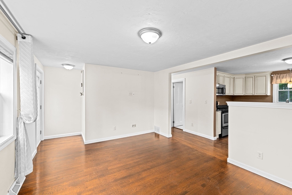74 Rochester Road Carver, MA 02330 - Photo 12 of 31 a view of empty room with wooden floor