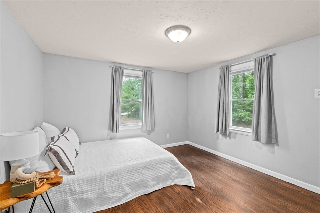 74 Rochester Road Carver, MA 02330 - Photo 13 of 31 a spacious bedroom with a bed and a window