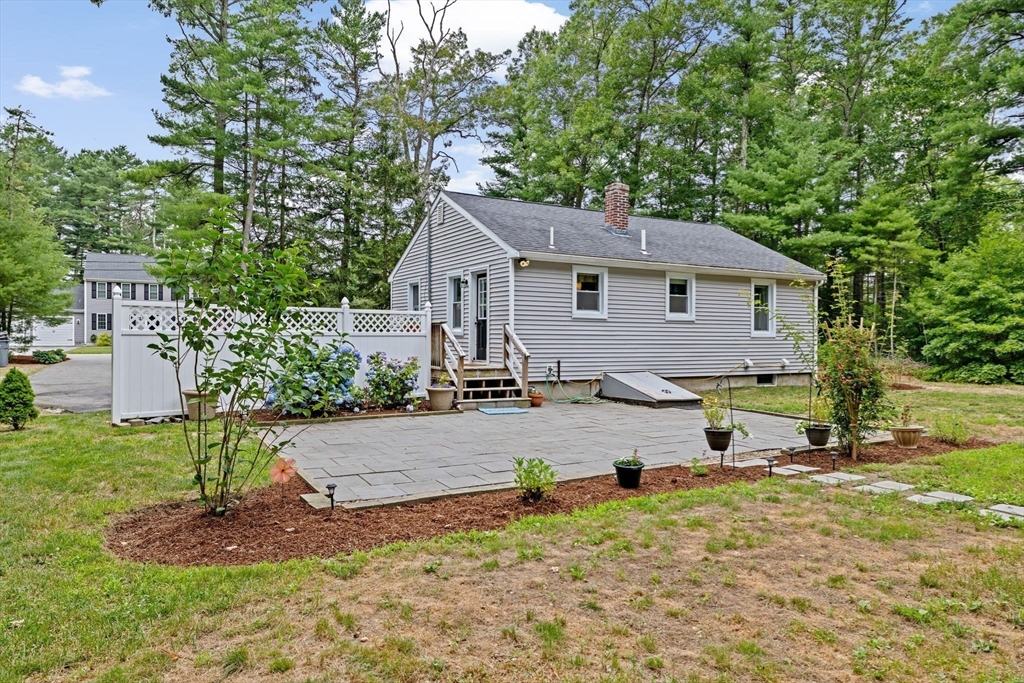 74 Rochester Road Carver, MA 02330 - Photo 22 of 31 a view of a house with a yard and tree s
