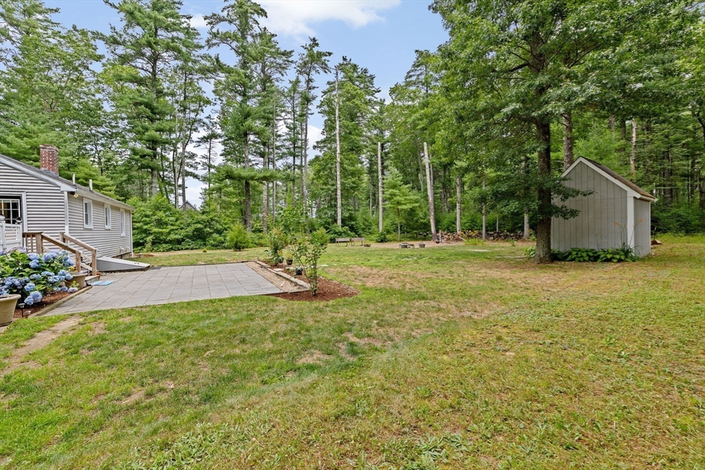 74 Rochester Road Carver, MA 02330 - Photo 24 of 31 a backyard of a house with lots of green space
