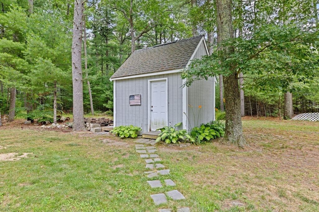 74 Rochester Road Carver, MA 02330 - Photo 25 of 31 a view of a house with yard and garden