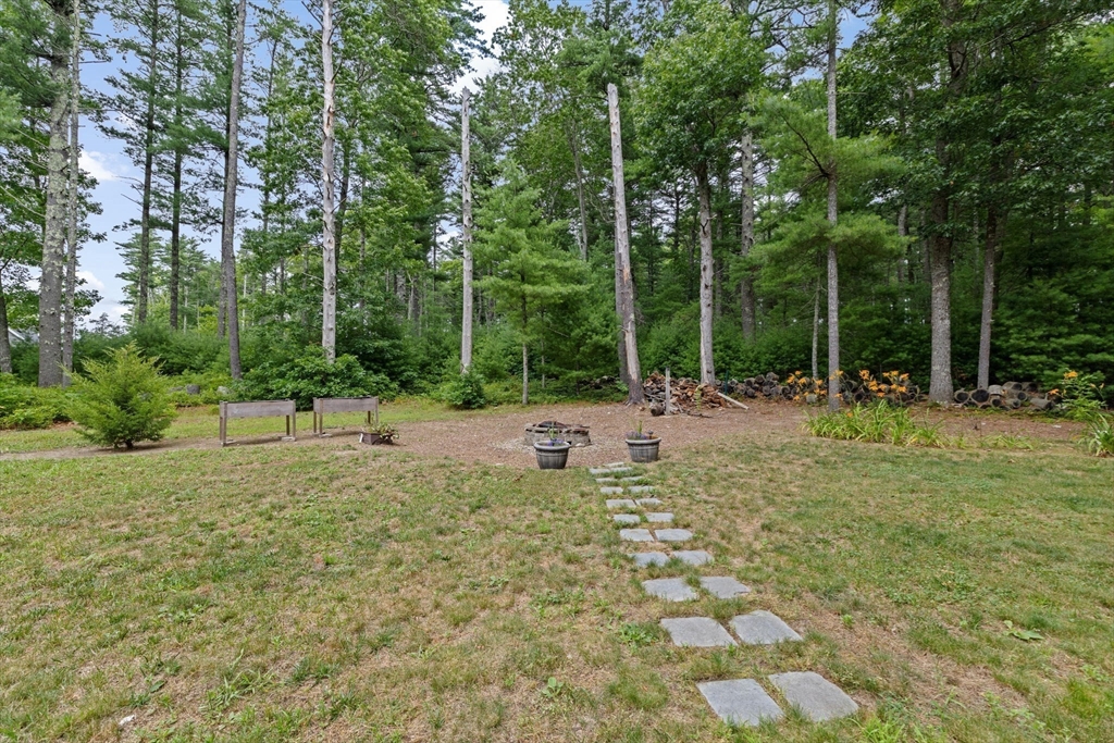 74 Rochester Road Carver, MA 02330 - Photo 26 of 31 a view of outdoor space with deck and trees