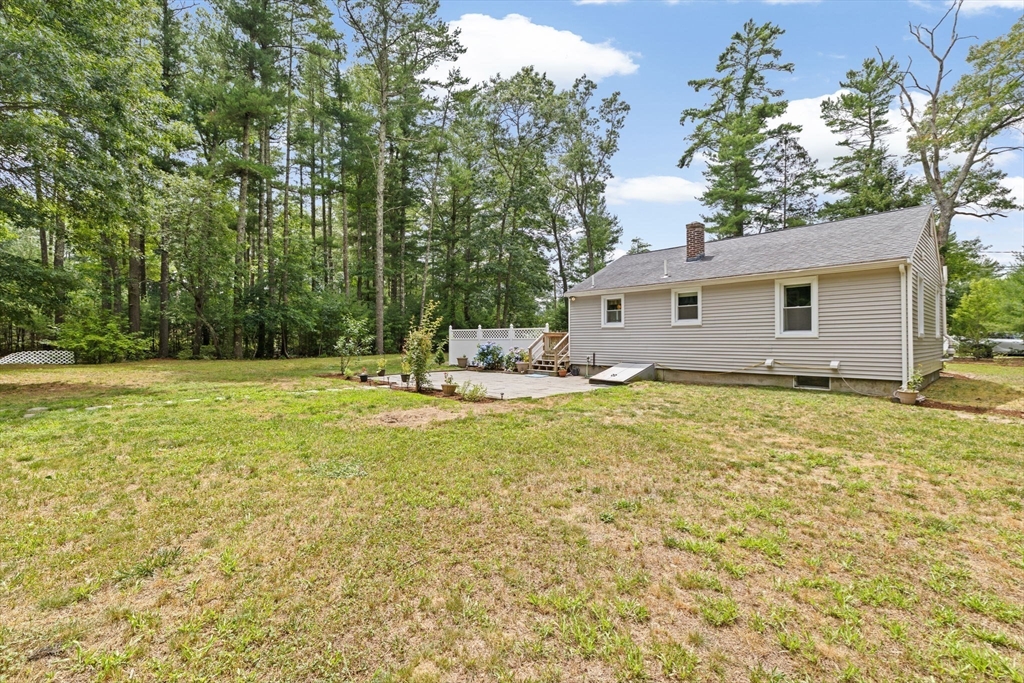 74 Rochester Road Carver, MA 02330 - Photo 27 of 31 a house view with swimming pool in front of it