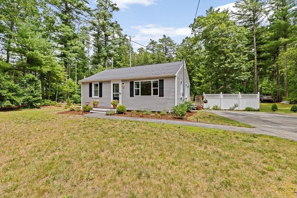 74 Rochester Road Carver, MA 02330 - Photo 30 of 31 a front view of a house with garden