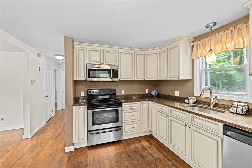 74 Rochester Road Carver, MA 02330 - Photo 3 of 31 a kitchen with a sink appliances cabinets and a window