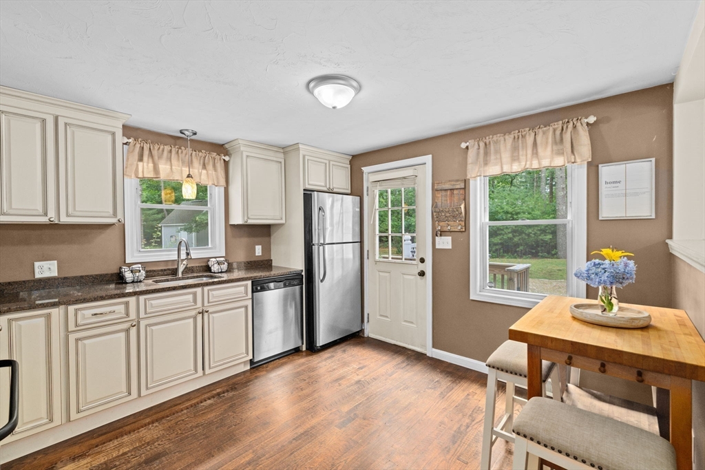 74 Rochester Road Carver, MA 02330 - Photo 4 of 31 a kitchen with a sink stove and cabinets